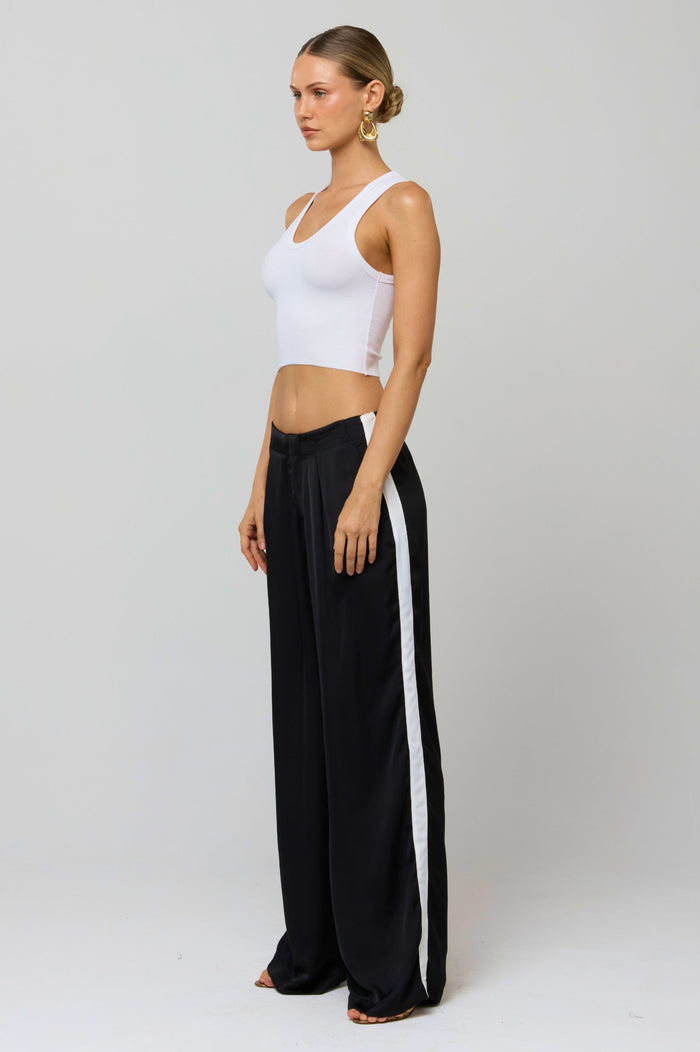 This is an image of Malcolm Trousers in Stripe - RESA featuring a model wearing the dress