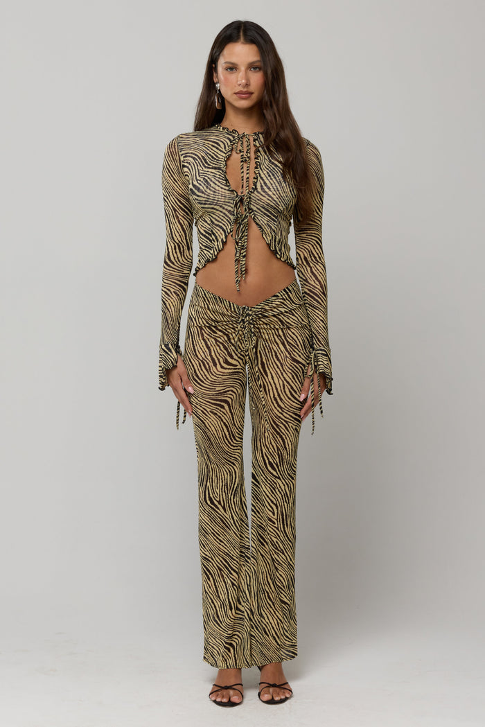 This is an image of Mallory Pant in Birch - RESA featuring a model wearing the dress