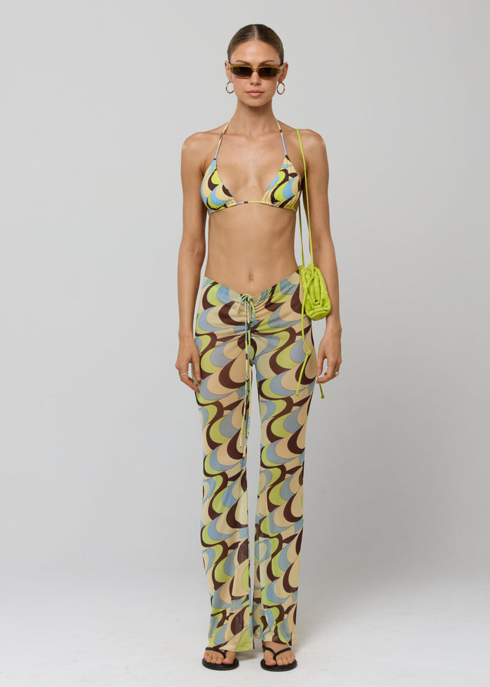 This is an image of Mallory Pant in Palm Royale - RESA featuring a model wearing the dress