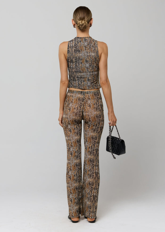 This is an image of Mallory Pant in Serpent - RESA featuring a model wearing the dress