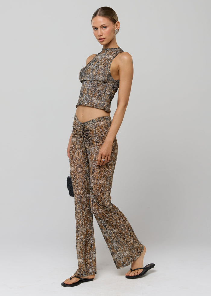 This is an image of Mallory Pant in Serpent - RESA featuring a model wearing the dress