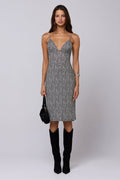 This is an image of Matilda Midi Dress in Flores - RESA featuring a model wearing the dress