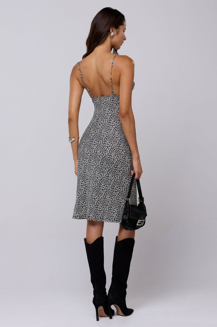 This is an image of Matilda Midi Dress in Flores - RESA featuring a model wearing the dress