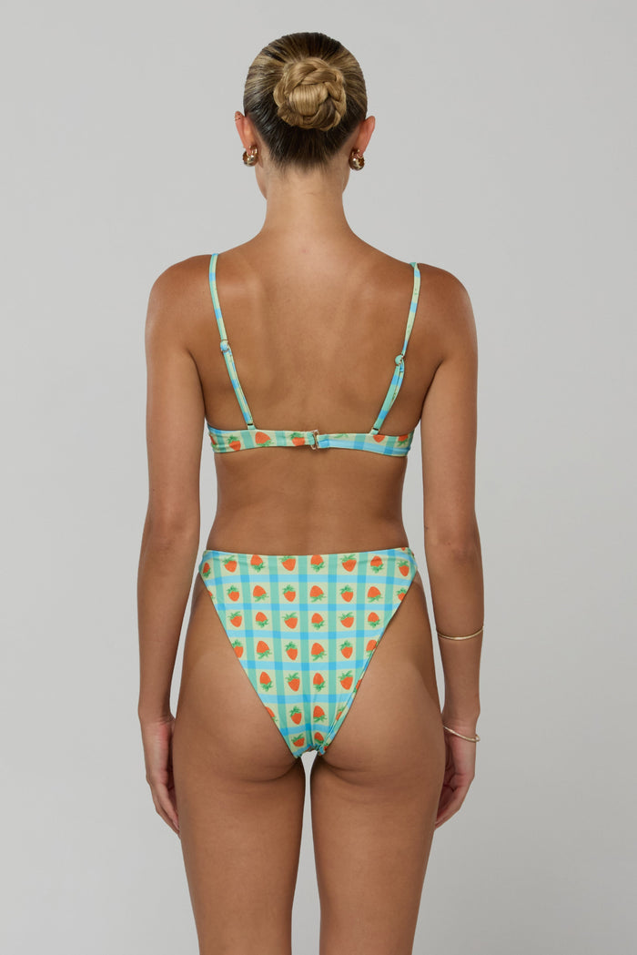 This is an image of Matty Bikini Top in Juicy - RESA featuring a model wearing the dress