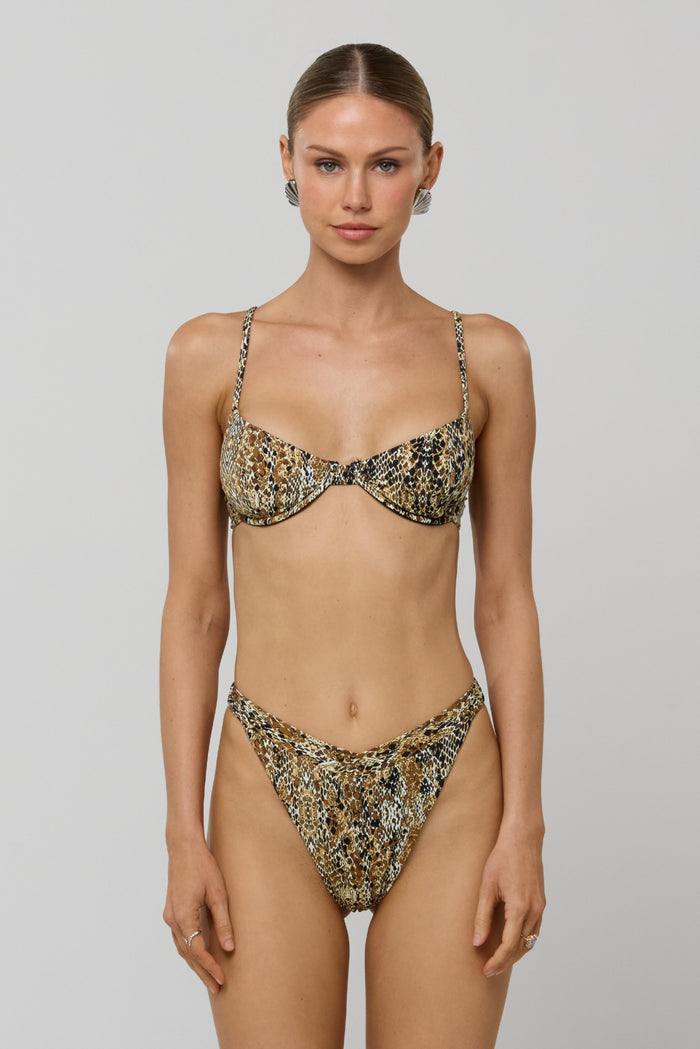 This is an image of Matty Bikini Top in Serpent - RESA featuring a model wearing the dress
