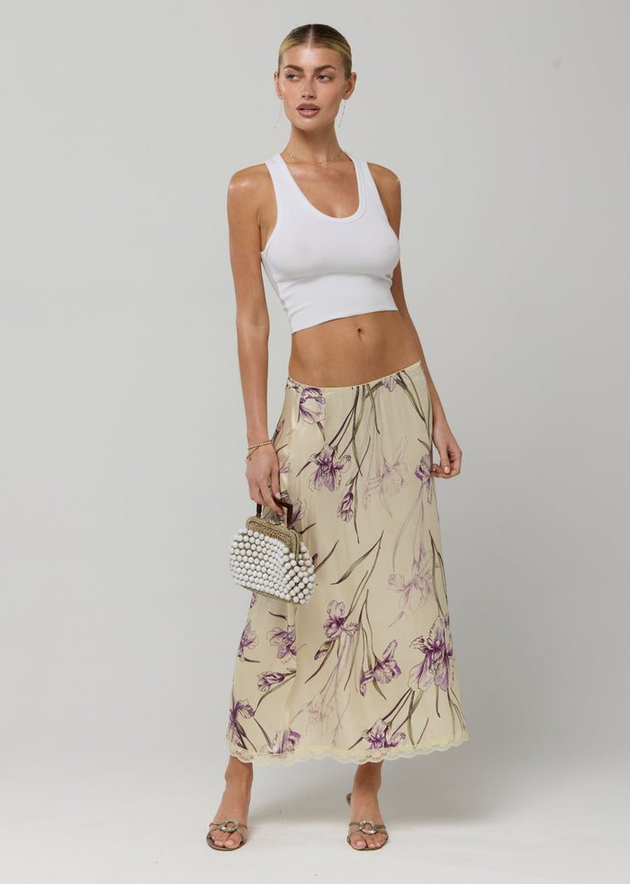 This is an image of Maxwell Skirt in Fern - RESA featuring a model wearing the dress