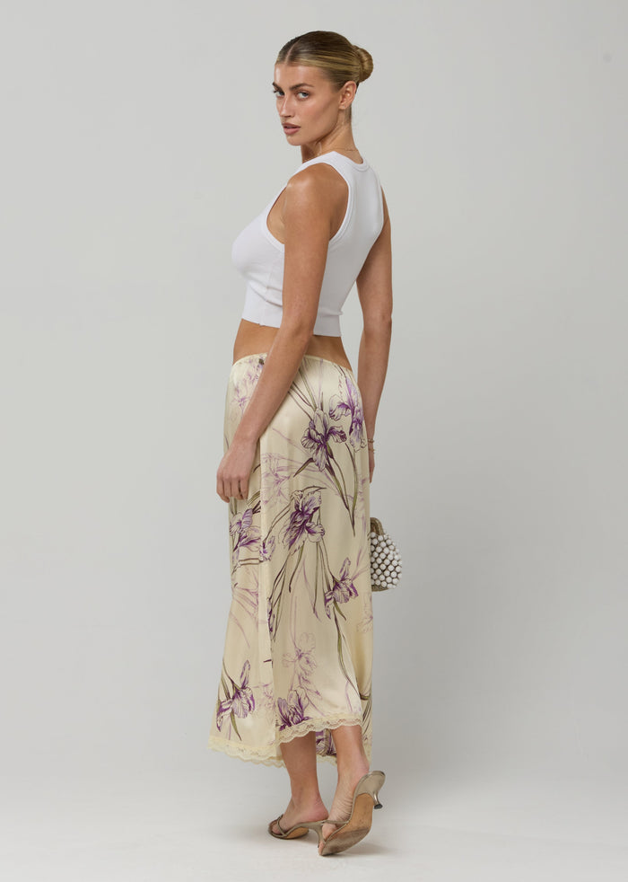 This is an image of Maxwell Skirt in Fern - RESA featuring a model wearing the dress