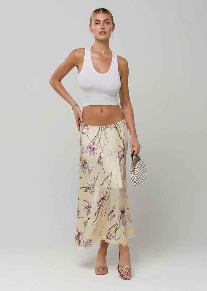 This is an image of Maxwell Skirt in Fern - RESA featuring a model wearing the dress