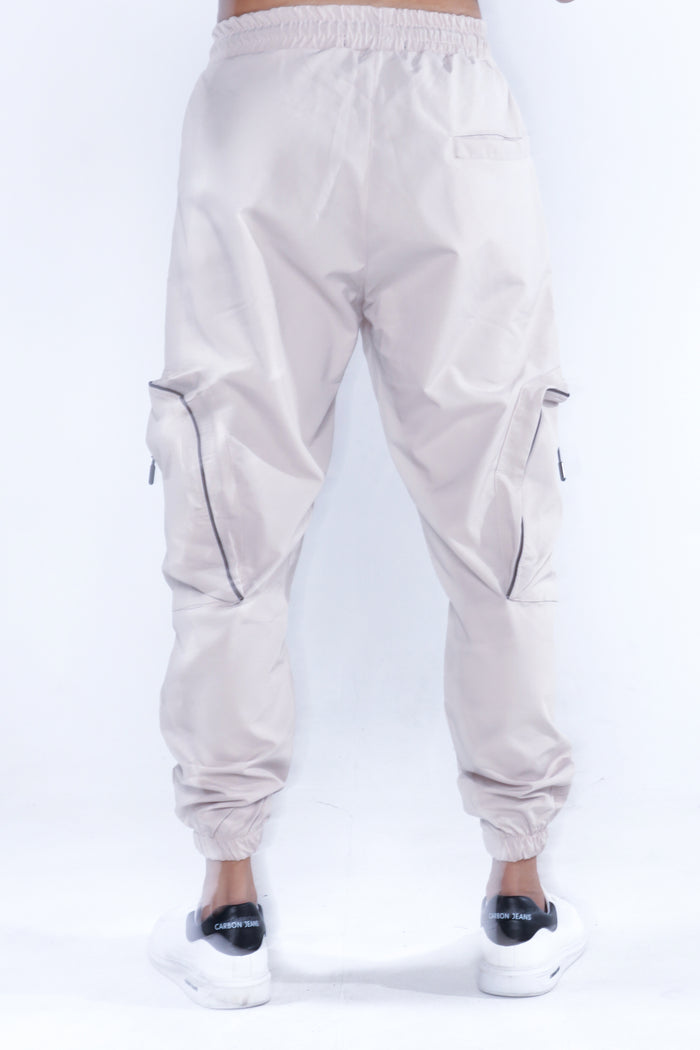 Rear view of Melvin Cargo Pants in stone. Slim fit streetwear utility trousers with zip pockets and elastic cuffs.
