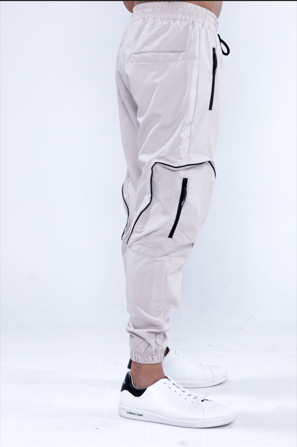 Melvin stone cargo pants with black zipper details and utility pockets, slim fit streetwear style.