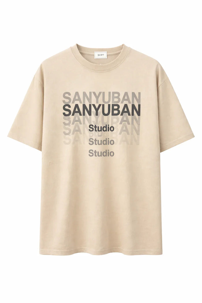 Beige graphic t-shirt with SANYUBAN Studio text print, short sleeves, casual style.