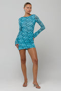 This is an image of Mia in Aquamarine - RESA featuring a model wearing the dress