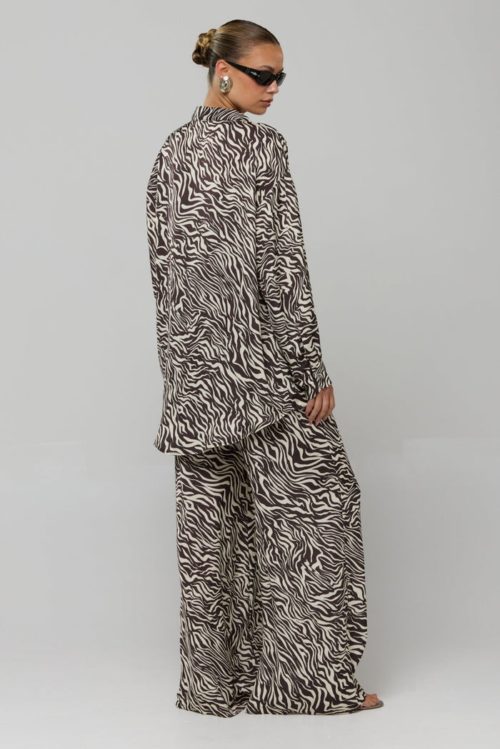 This is an image of Miley Set in Selva - RESA featuring a model wearing the dress