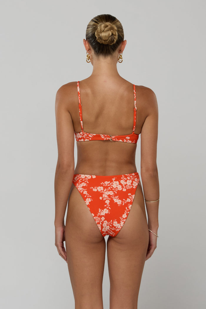 This is an image of Millie Bikini Top in Orange Blossom - RESA featuring a model wearing the dress