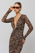 This is an image of Mira Dress in Terra - RESA featuring a model wearing the dress