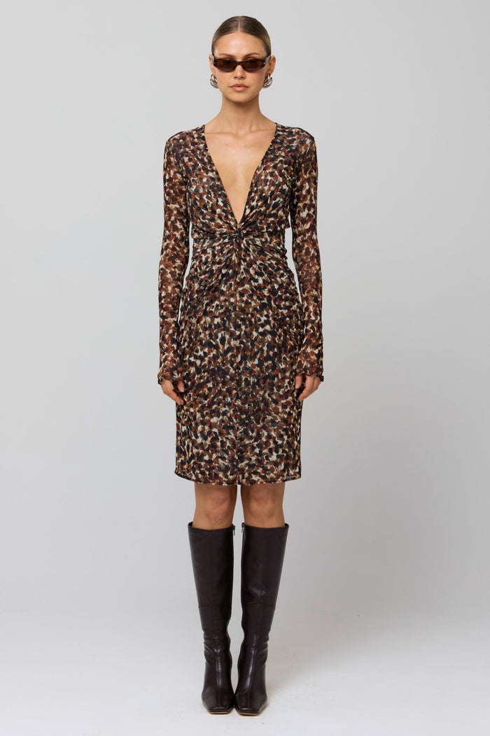 This is an image of Mira Dress in Terra - RESA featuring a model wearing the dress