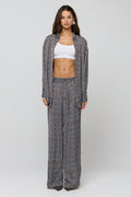 This is an image of Monica Blouse in Tide - RESA featuring a model wearing the dress