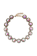 Naomi iridescent statement necklace set with matching earrings, featuring ornate floral crystal clusters and an elegant shimmering finish.