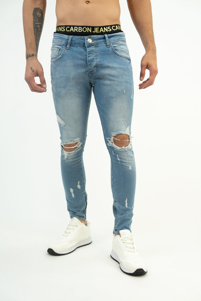 Men's Neil Jeans in blue washed denim with distressed knees and a skinny fit by Carbon Jeans.