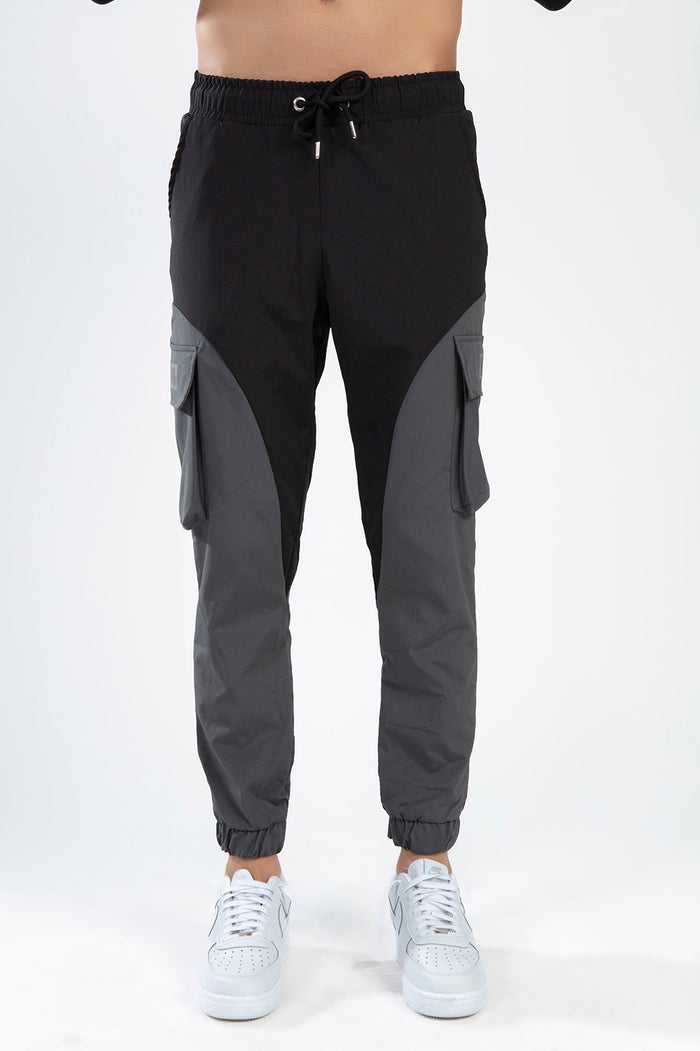 Not Now Pants - Black and grey two-tone cargo pants with drawstring waist and jogger cuffs front view.