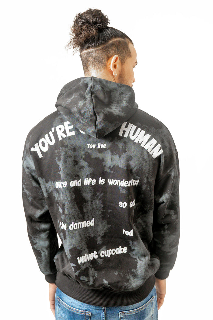 Back of the Only Human Hoodie in black and grey tie-dye, featuring white streetwear graphic text on a relaxed fit.