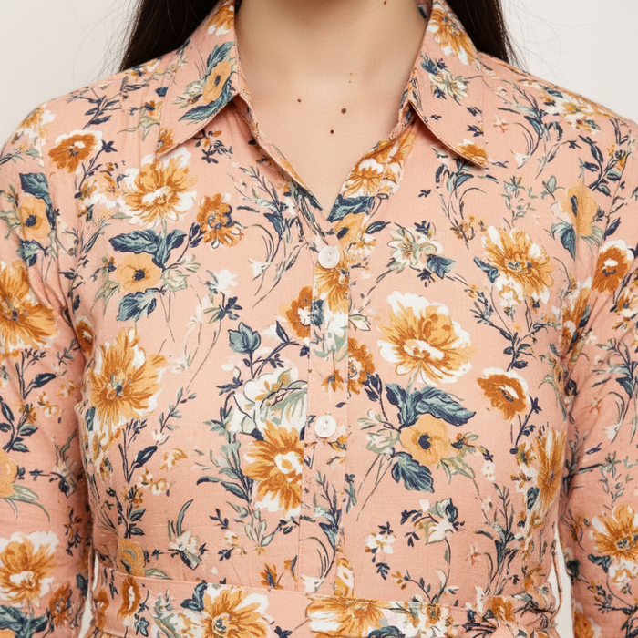 Close-up of pink floral dress keyhole neckline and gathered waist detail