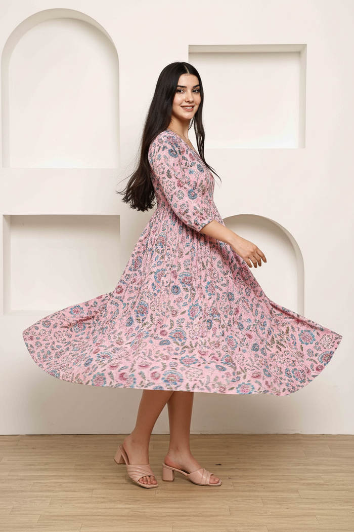 Pink floral midi dress showing flare and movement - flowing skirt with gathered waist