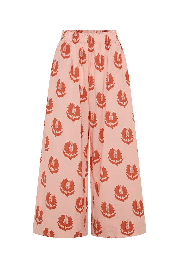 Ria Pants Cherry Blossom — ghost mannequin front view on white background, cherry blossom hand block print cotton wide-leg pants with elastic waist, pink floral motif on cream, artisan Jaipur India | Daughters of India