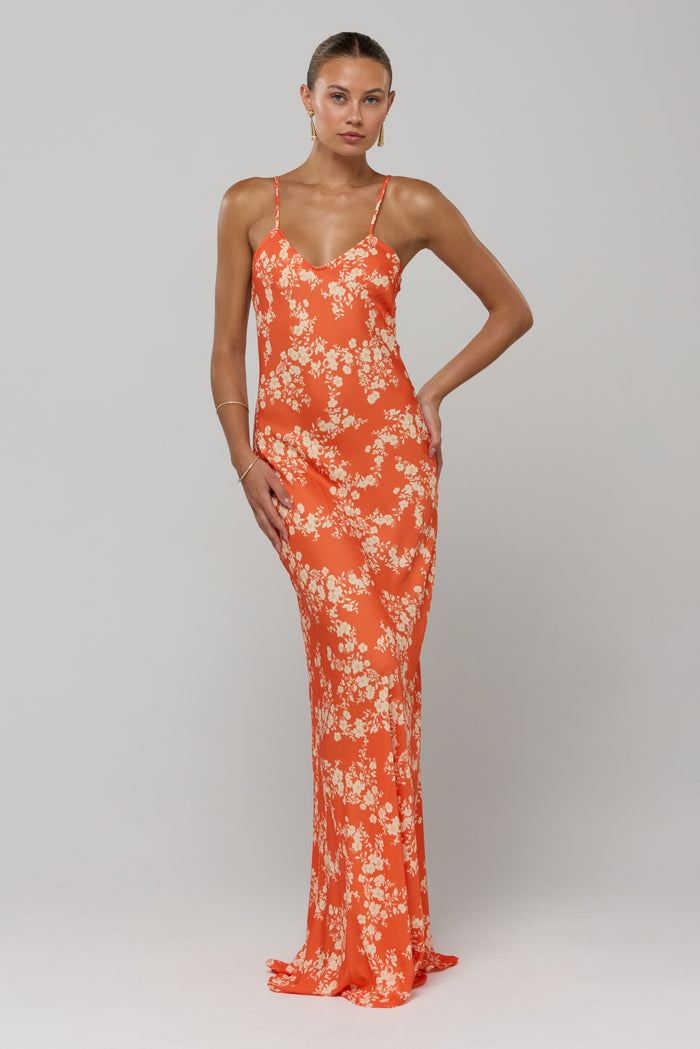This is an image of Rose Maxi in Orange Blossom - RESA featuring a model wearing the dress