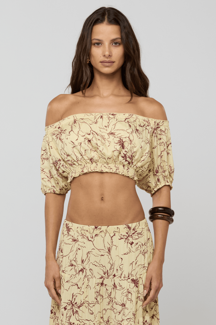 This is an image of Saige Top in Butterscotch - RESA featuring a model wearing the dress