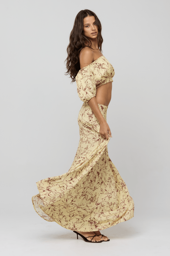 This is an image of Saige Top in Butterscotch - RESA featuring a model wearing the dress