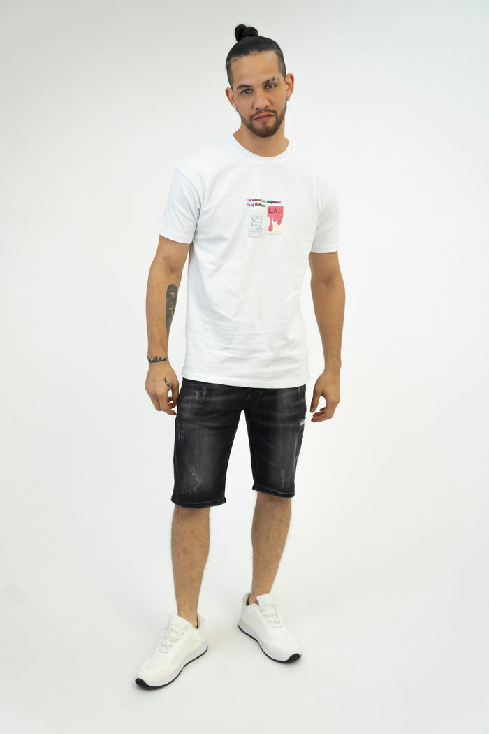 Model in Samuel black washed denim shorts with distressing and a white graphic tee against a studio background.