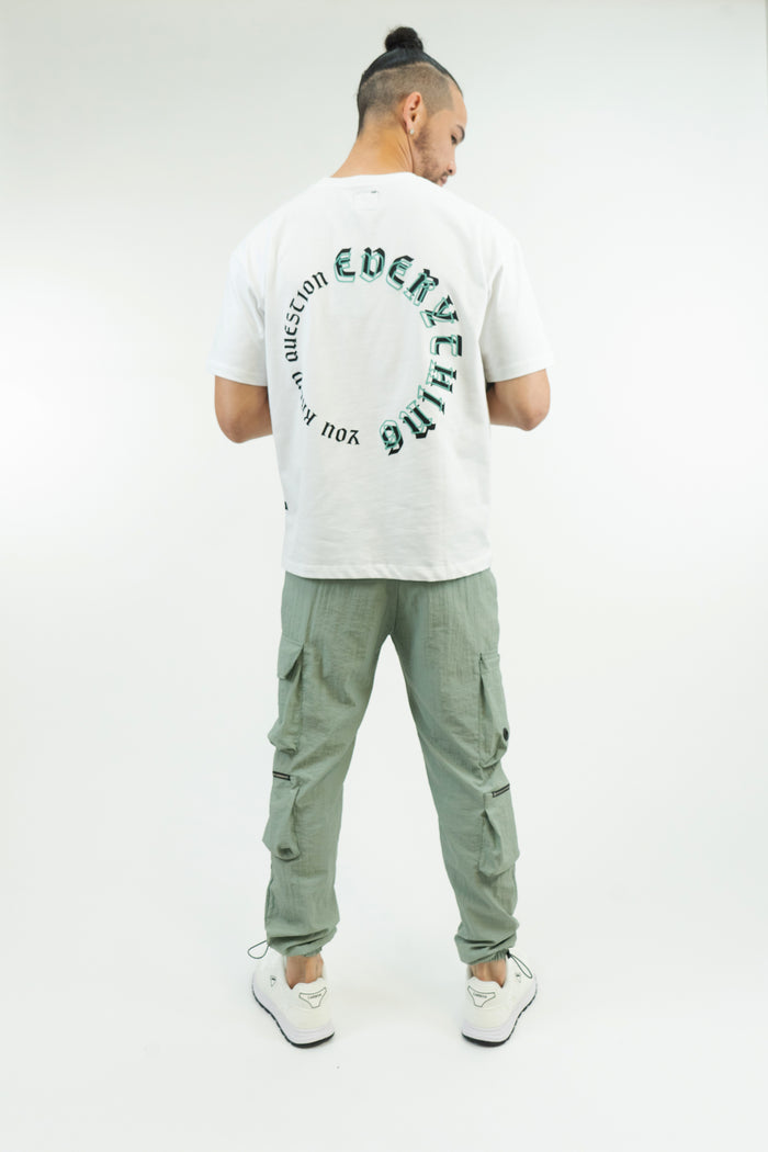 Back view of Sean Pants in Mint, featuring cargo pockets and zippers on relaxed fit streetwear trousers for men.