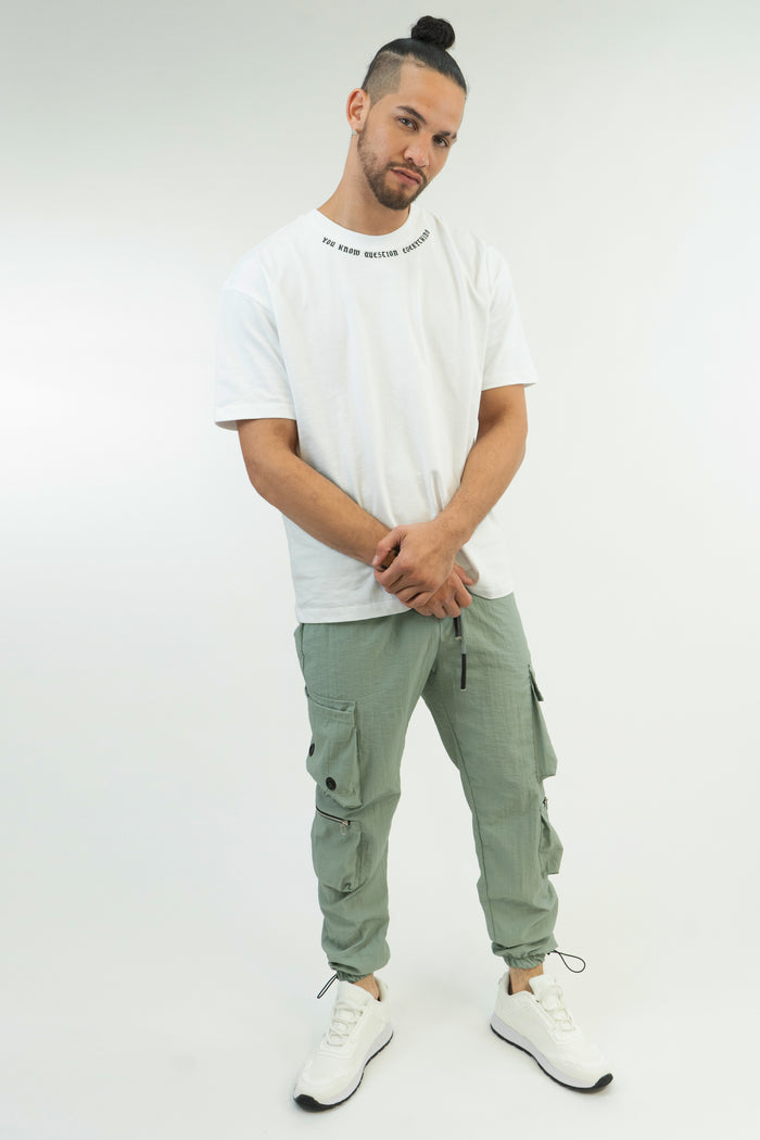 Model wearing Sean Pants in Mint, featuring a relaxed fit, cargo pockets, and adjustable drawstring cuffs.