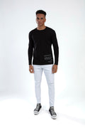 Man in a Show Must Go On black long-sleeve graphic tee by Carbon Jeans, paired with white distressed streetwear denim.