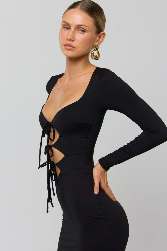 This is an image of Simone Dress in Black - RESA featuring a model wearing the dress