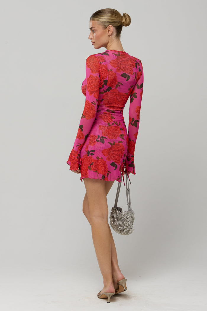 This is an image of Sloane Mini in Rosebud - RESA featuring a model wearing the dress