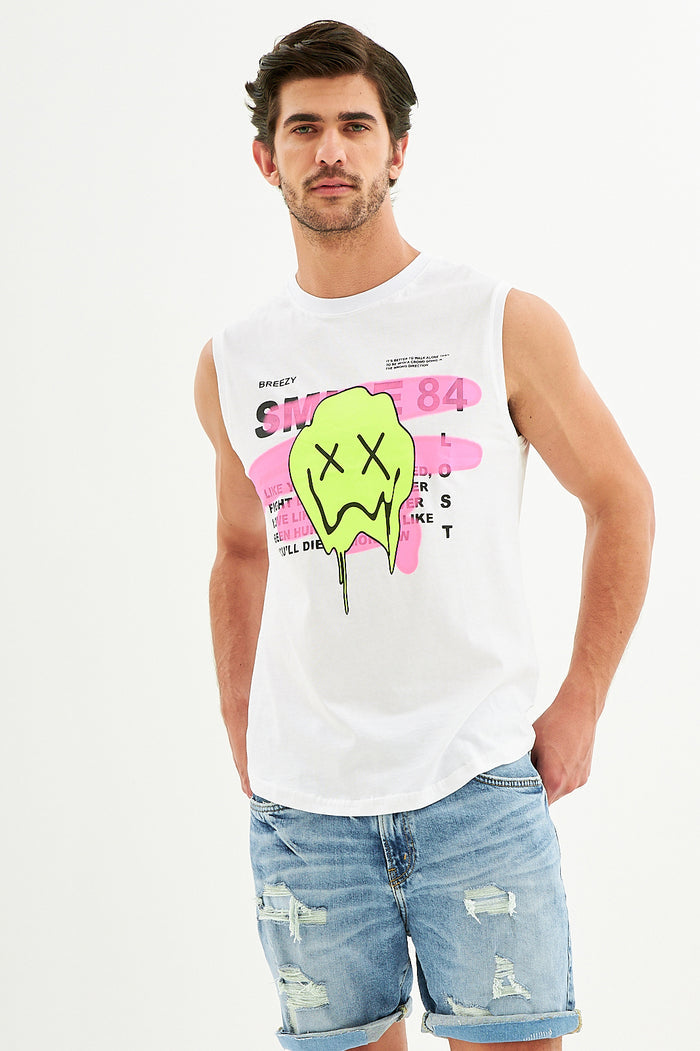 Man wearing a white Smile Graphic Tank Top with neon dripping smiley face and pink streetwear text in a front studio view.