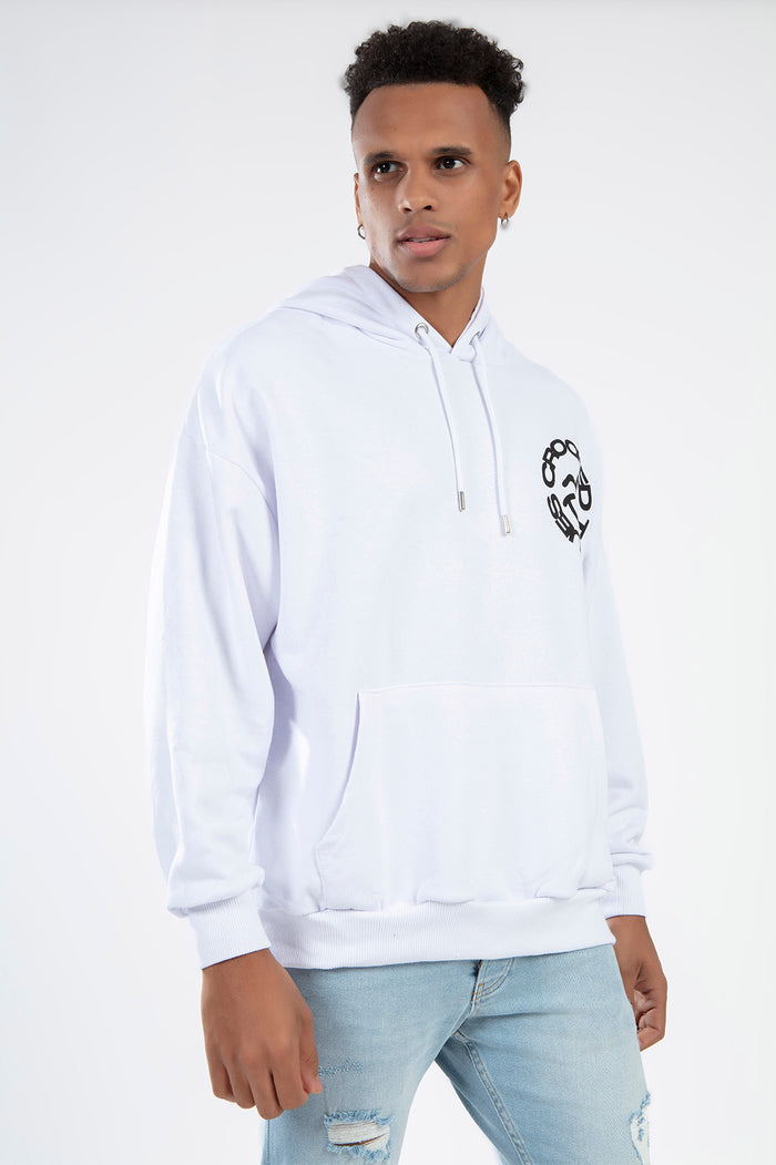 Man in white Smiley Graphic Streetwear Hoodie by Carbon Jeans with front pouch pocket and chest graphic.