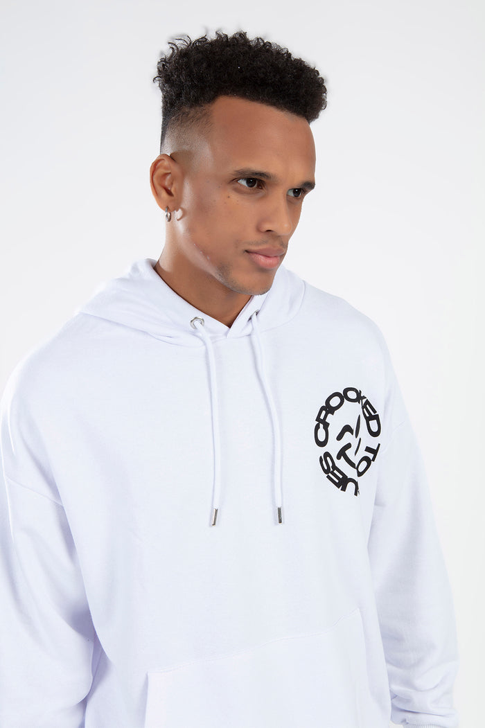 Model wearing a white Smiley Streetwear Hoodie by Carbon Jeans with a black circular graphic on the chest.