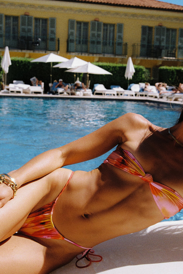 This is an image of Spencer in Lilikoi - RESA featuring a model wearing the dress