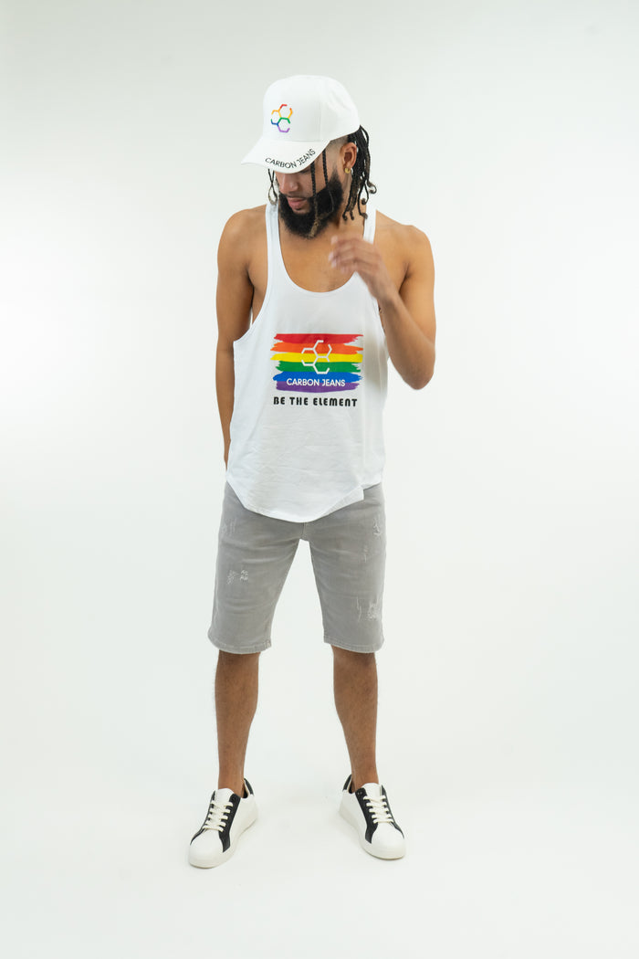 Man in white bodybuilding stringer pride tank top with rainbow Carbon Jeans logo and Be The Element text.