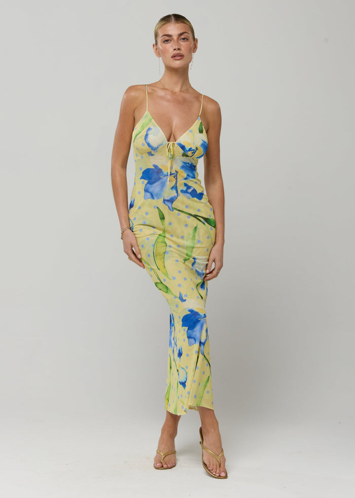This is an image of Suki Dress in Solei - RESA featuring a model wearing the dress