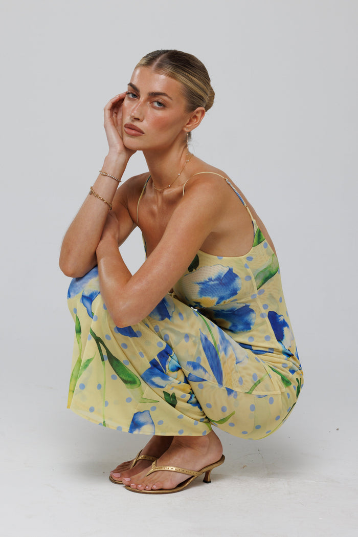 This is an image of Suki Dress in Solei - RESA featuring a model wearing the dress