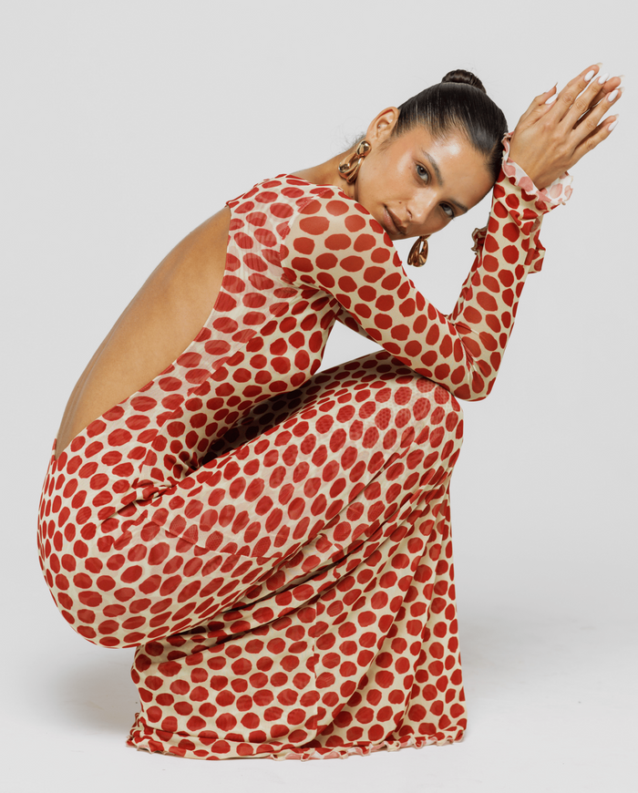 This is an image of Sylvia Dress in Campari - RESA featuring a model wearing the dress