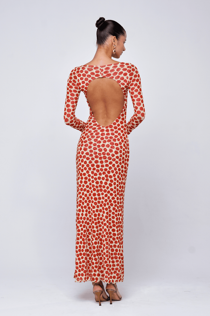 This is an image of Sylvia Dress in Campari - RESA featuring a model wearing the dress