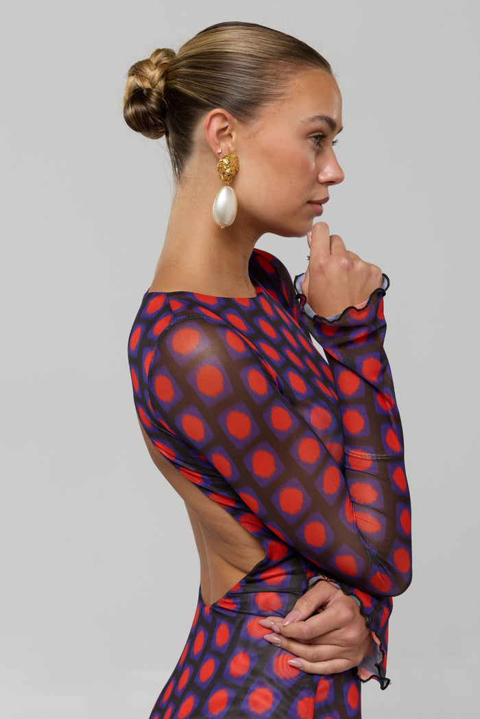 This is an image of Sylvia Dress in Mod - RESA featuring a model wearing the dress