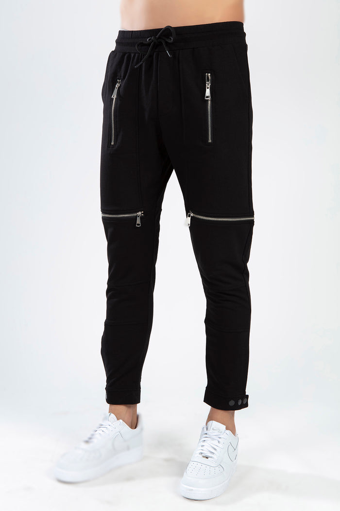 Tobias black slim-fit streetwear pants featuring silver zipper accents, drawstring waist, and ribbed panels.