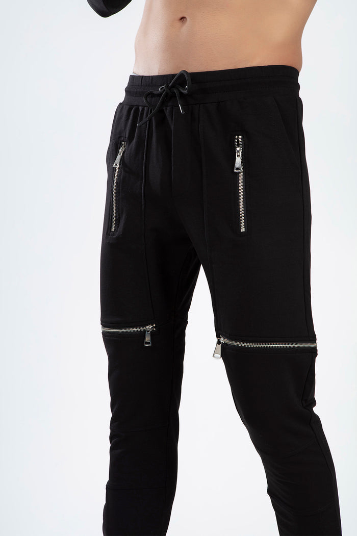 Men's Tobias black slim-fit streetwear pants featuring silver vertical hip zippers and horizontal knee zippers.