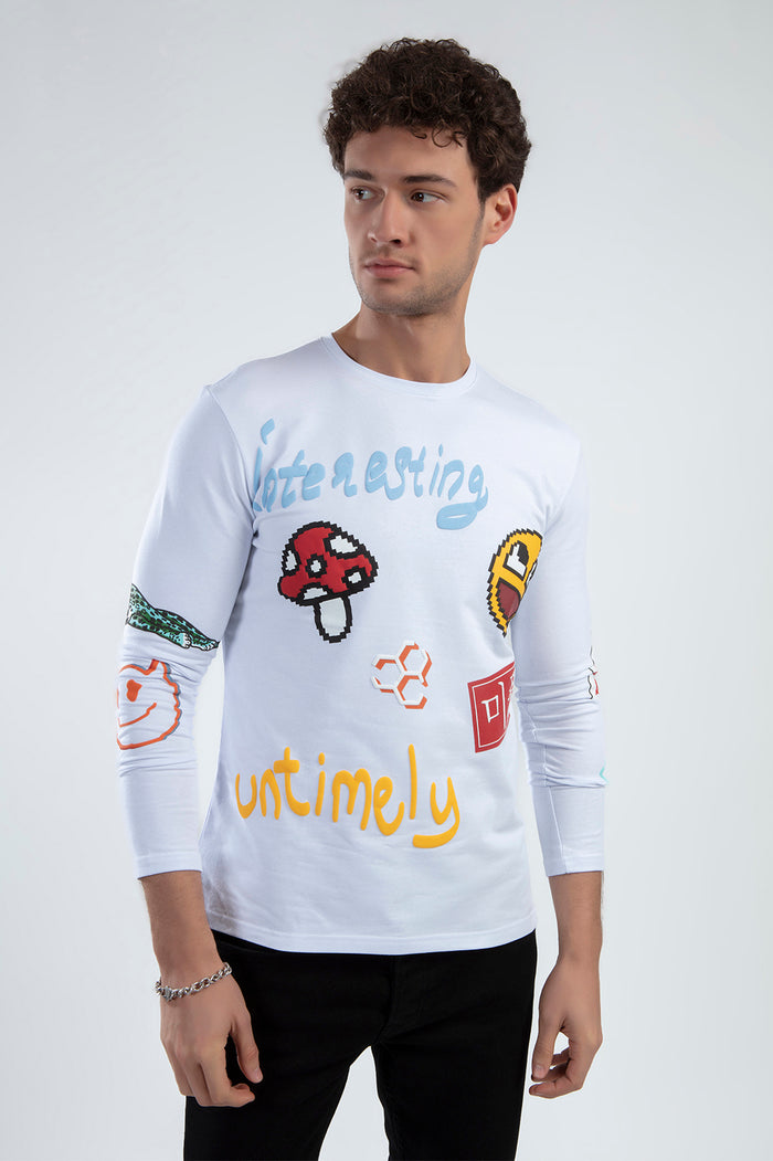 Man wearing the Untimely white long-sleeve shirt with colorful pixel art graphics and puff print streetwear designs.
